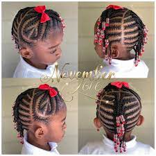 This kid has been decorated with thick cornrows braids and the braids are tied into two beautiful knots by the two sides of the head. 50 Kids Braids With Beads Hairstyles Black Beauty Bombshells Lil Girl Hairstyles Little Girl Braids Kids Braids With Beads