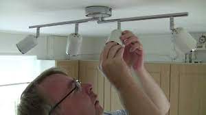 Usually there is a decorative plate or canopy piece hiding attach the light fixture mounting bracket to your ceiling box, making sure you weave the wires through the new plate so you can reconnect them. Changing A Lightbulb Britaininaday Youtube
