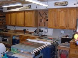 Install slat walls for a fully customized garage. My Woodshop Storage Ideas Recycling Kitchen Cabinets Into Garage Storage Units Dengarden