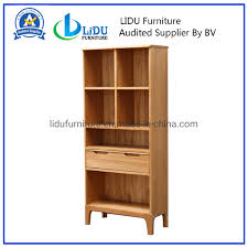 Metal cabinets are typically more durable, making them suitable for industrial environments. China Wide Bookcase With High Quality Industrial Modern Oak Wooden Bookshelf With Storage Cabinet With Draw China Wooden Shelf Oak Wood