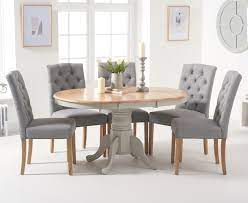 Have a dining room in your home which spells luxury. Epsom Oak And Grey Pedestal Extending Dining Table With Claudia Grey Fabric Dining Chairs