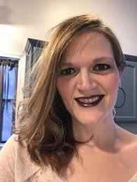 Who is a good hair stylist in Ludington for growing out bangs and gray hair?