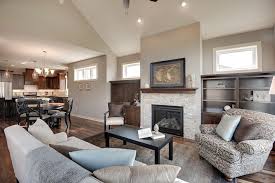 Sherwin Williams Amazing Gray For A Transitional Living Room With A Transom Windows And The Trillium Ii By Iverson Homes Anew Gray Home Interior Wood Shutters