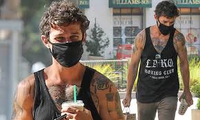 I thought when shia labeouf ate a damn steak with his bare hands he had reached the peak of personal sleaze. Shia Labeouf Flashes His Tattooed Muscles As He Grabs Breakfast Daily Mail Online