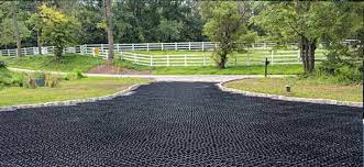 That pile of asphalt to either side of me? Driveway Paving Alternatives A Guide To Selecting A Better Driveway Solution Truegrid Pavers