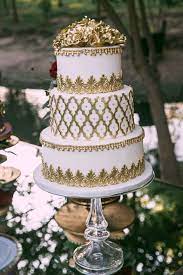 White Gold Wedding Cake Three Layered Cake Gold Detailing Royal Wedding Theme Photog White And Gold Wedding Cake Royal Wedding Cake Gold Wedding Cake