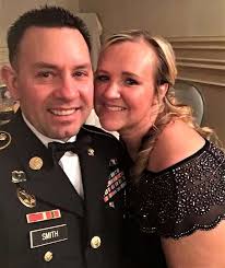 Sgt. 1st Class James Smith and Sarah Smith pose for