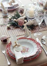 This muted beach style living room from designer carolyn thayer speaks to the cool grays found in the northeast—it's light and breezy during the day, and warm and cozy at night. Holiday At The Beach Beach Christmas Decorations Beach Christmas Beach Wedding Table Settings