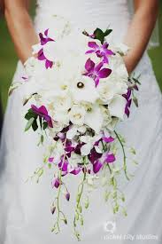 Glamorous Cascading Bridal Bouquet Which Features White Roses White Calla Lilies White Dendrobi Wedding Flowers Cascading Wedding Bouquets Wedding Bouquets