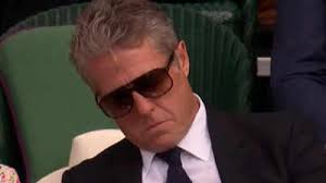 Hugh Grant goes viral after falling asleep behind Queen Camilla during  Novak Djokovic match at Wimbledon 2025