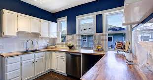 Maybe you would like to learn more about one of these? Kitchen Interior With White Cabinets And Bright Navy Walls Blue Kitchen Walls Navy Kitchen Walls Blue Kitchen Walls White Cabinets