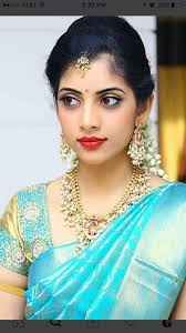 South Indian Bride Gold Indian Bridal Jewelry Temple Jewelry Jhumkis Teal Blue Silk Kanchip Saree Hairstyles Wedding Saree Collection South Indian Hairstyle