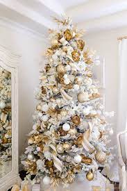 From ornaments and garlands to toppers and skirts, here are our 12 most dazzling white christmas tree decor ideas that will ensure yours is as polished as you are this year. Elegant White And Gold Christmas Bedroom Tour Randi Garrett Design Elegant Christmas Trees Gold Christmas White Christmas Trees