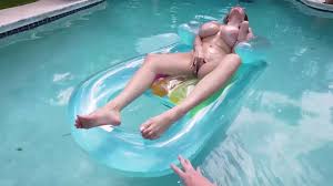 Immerse in naked fun with this MILF in the pool