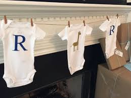 Diy Onesie Garland For Baby Shower Custom To Your Party S Theme Baby Shower Diy Onesies Garland