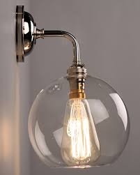 An led wall sconce will last a long time and doesn't produce heat like other bulbs, so it's perfect for flush mount lighting. Lenham Clear Glass Globe Wall Light