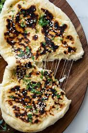 Cheese Stuffed Garlic Naan Simply Delicious Recipe In 2020 Garlic Naan Garlic Naan Recipe Naan Recipe