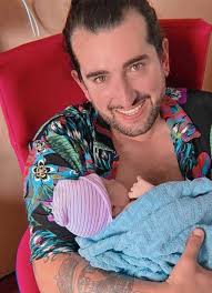 Daddy Brian and Papa Arthur shower baby Blake with love
