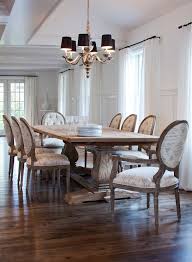 Sophisticated Dining Room With Reclaimed Wood Trestle Dining Table Surrounded By French Script Dining Fabric Dining Room Fall Dining Room French Dining Chairs