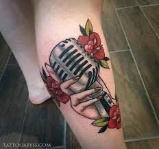 Simple designed black ink vintage microphone tattoo on arm. Hand Holding Vintage Microphone Tattoo Abyss Montreal