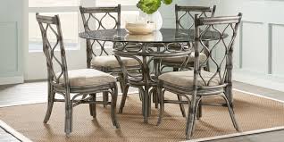 Circular designs accent the round drum table base. Glass Top Dining Room Table Sets With Chairs