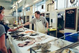 Fishmongers can be wholesalers or retailers, and are trained at selecting and purchasing, handling, gutting, boning, filleting, displaying, merchandising and selling their product. The Market Plaice Fishmonger Plymouth Market