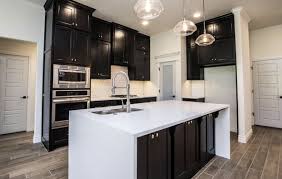 Black kitchen cabinets with white quartz countertops. Black Kitchen Cabinets With White Waterfall Quartz New Home Designs Black Kitchen Cabinets New Homes