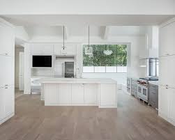 Some Tips To Clean And Care Of Modern White Kitchens With Wood Floors White Modern Kitchen White Modern Kitchen White Kitchen Wood Floors Wood Floor Kitchen
