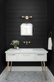 A cozy grey farmhouse bathroom with lace curtains, wood, grey planks on the walls and a mosaic tile floor. Scandinavian Farmhouse Home Naperville Historic District Interior Ship Lap Walls Shiplap Bathroom