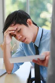 A Young Junior Employee Feels Headache when the Boss Abuses Him about His  Wrong or Low-quality Work Stock Image