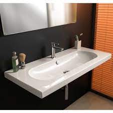 Translucent glass maintains the open feel of the bathroom, so small spaces feel larger. Nameeks Edo Wide Wall Mounted Ceramic Bathroom Sink Square 39 57 In X 17 72 In Rona