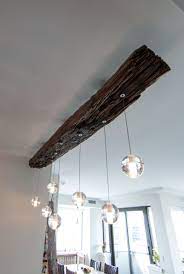 Simple steps and materials make it easy to turn these cool objects into light fixtures with a history. Rail Sleeper Bocci Pendant Light Zenporium Wood Light Fixture Rustic Lighting Wood Light