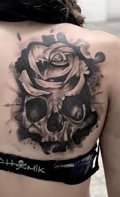 Hand skeleton and rose uv tattoo. Skull Tattoos Their Different Meanings Plus Ideas Photos