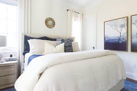 For the bedroom, a leaning floor mirror, door mirror, or dresser. Blue And White Bedroom With Gold Sunburst Mirror Transitional Bedroom