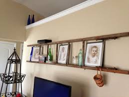 Repurposed Old Wooden Ladder Used L Brackets To Hang Away From Wall Vintage Ladder Reuse Wall Shelf Rustic Decor Decor Old Ladder Decor