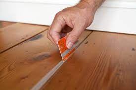 My son dragged a heavy cabinet across my floor and caused some deep scratches. Filling Gaps In Floorboards With Stopgap