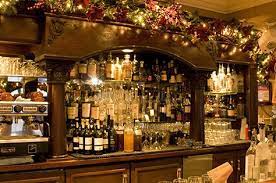 Host your party in an irish pub. Christmas Decorations In A Pub Christmas Interiors Pub Decor Christmas Table Centerpieces