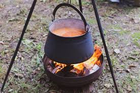 Cauldron with Soup Cooking Over the ...