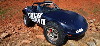 Miatas might be great on the track, but they look just as fun driving through a pool of mud. Off Roadster An Off Road Go Anywhere Miata Articles Grassroots Motorsports