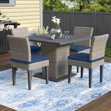 For sets that include an outdoor dining table and chairs, this gives enough room for guests to sit comfortably around the table. Sol 72 Outdoor Brennon Square 4 Person 39 5 Long Dining Set With Cushions Wayfair