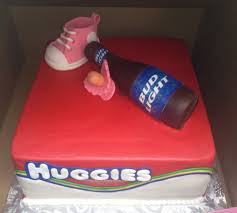 A beer can cake decorated with actual cupcakes and candles! Chuggies Huggies Beer Babies Ba Shower Cakes Pinterest Throughout Diaper Party Cake Ideas