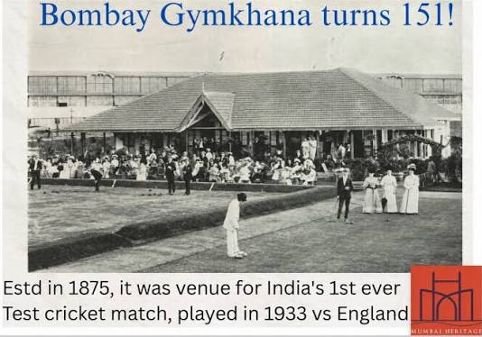 Bombay circa 1950s? When the traffic went around the Fountain. When there were many double deckers. When the trams were still around. When people wore more white than color. When the street