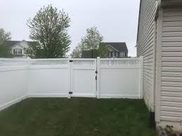 Traditional White Vinyl Fence With Mini Diagonal Lattice Topper Surrounds This Yard In Bethlehem Installed By Skip White Vinyl Fence Vinyl Fence White Vinyl