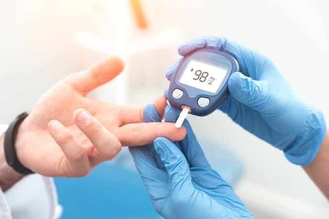 Diabetologist reviewing blood sugar reports at Profrea