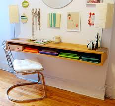 A multifunctional floating desk is a dreamy option for a petite home office. 8 Wall Mounted Desks That Save Room In Small Spaces
