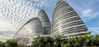 An open concept floor plan typically turns the main floor living area into one unified space. Wangjing Soho En