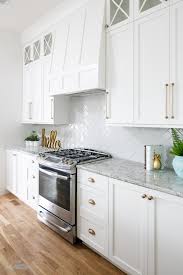 White Kitchen Design With Marble Countertops And Gold Accents Artisan Signature Homes Kitchen Cabinet Design White Kitchen Design Kitchen Remodel
