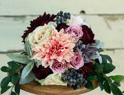 The most common silk winter bouquets material is silk. Silk Plum Blush Fall Winter Wedding Bouquet Dahlia Pink Plum And Blush Rose Silk Bouquet Winter Wedding Bouquet Wedding Bouquets Wedding Flowers