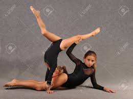 Euro stars gymnastics was the dream of two former national olympic team members, peter and tania. Two Little Girls Sisters Are Engaged In Gymnastics Girls Do Gymnastic Tricks On The Floor Stock Photo Picture And Royalty Free Image Image 109083189