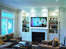 Since a tv room is an area where you spend a lot of time to recharge why not create built in tv units and put your passions on show with open shelving. Built In Wall Unit American Traditional Living Room Toronto By Times Kitchen Bath Houzz